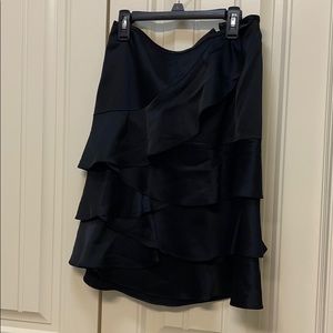 Knee length black ruffle skirt